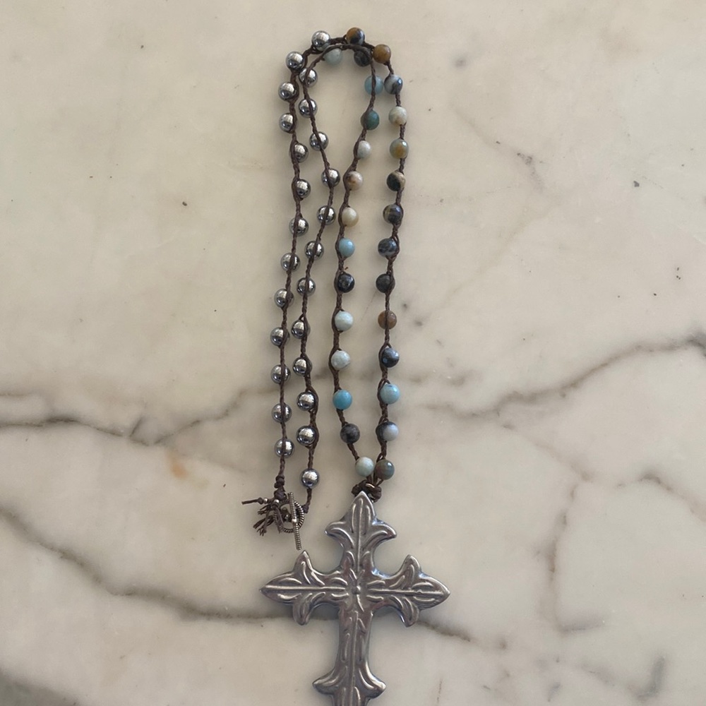Cross Necklace with beautiful bead detailing. Turquoise & silver in color.
